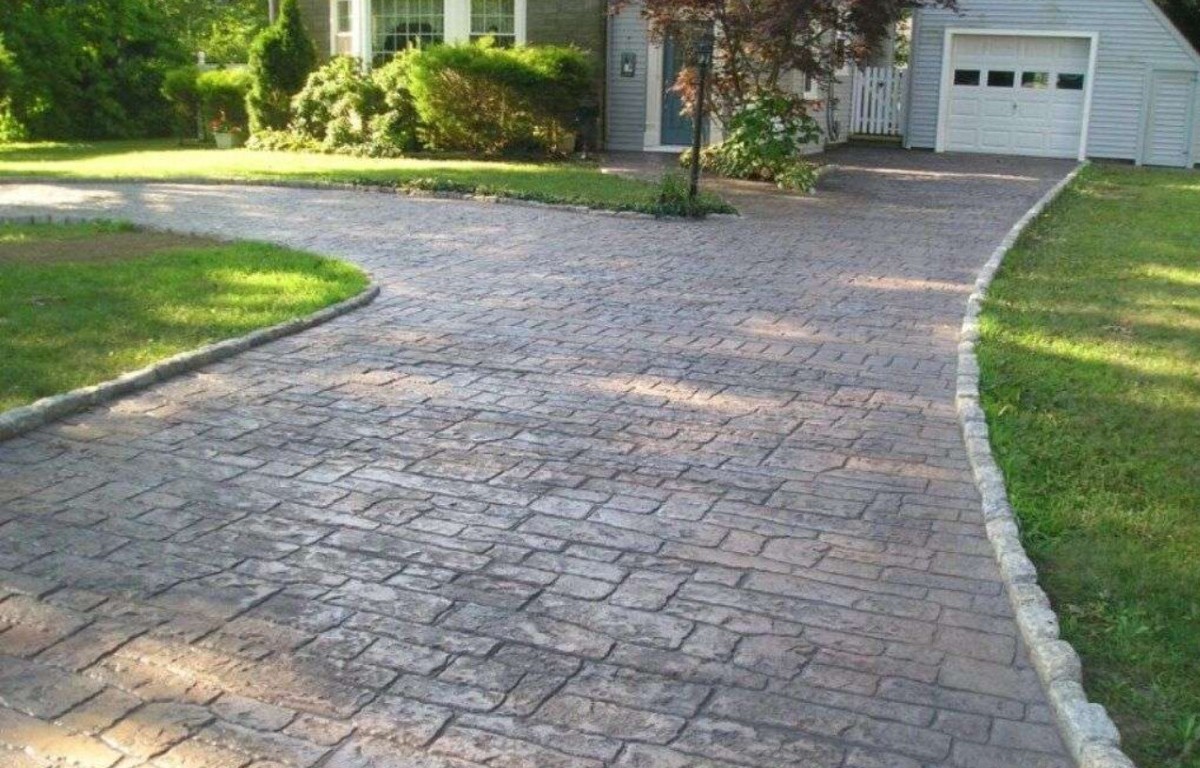 Stamped and decorative concrete driveway with custom pattern design
